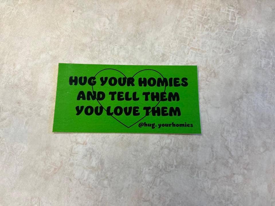 "Hug Your Homies": The Story Behind a Little Sticker With a Big Goal "Hug Your Homies": The Story Behind a Little Sticker With a Big Goal