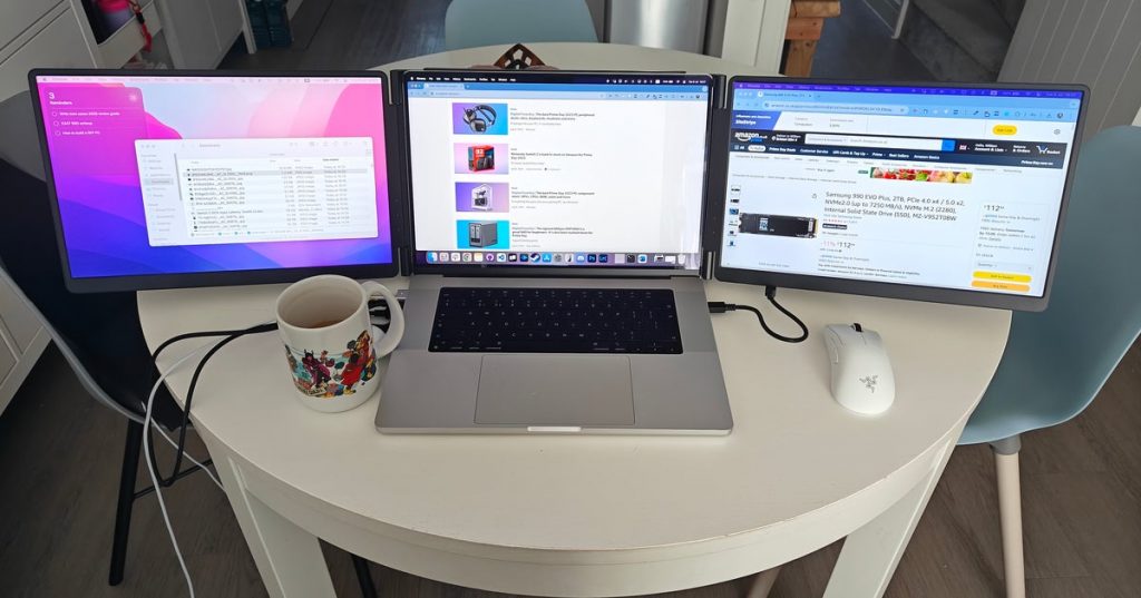 Tools of the trade: a triple screen laptop is how I'm covering Amazon's Prime Day sales