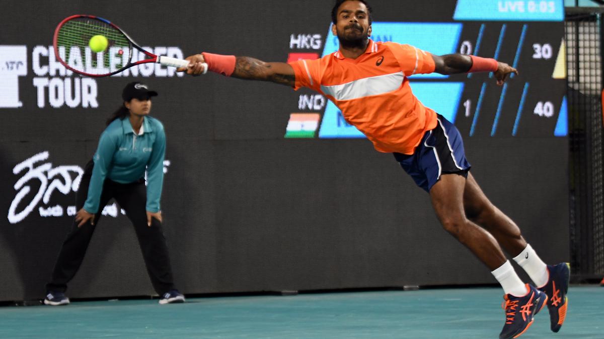 Nagal surmounts Wang’s challenge to make the last eight