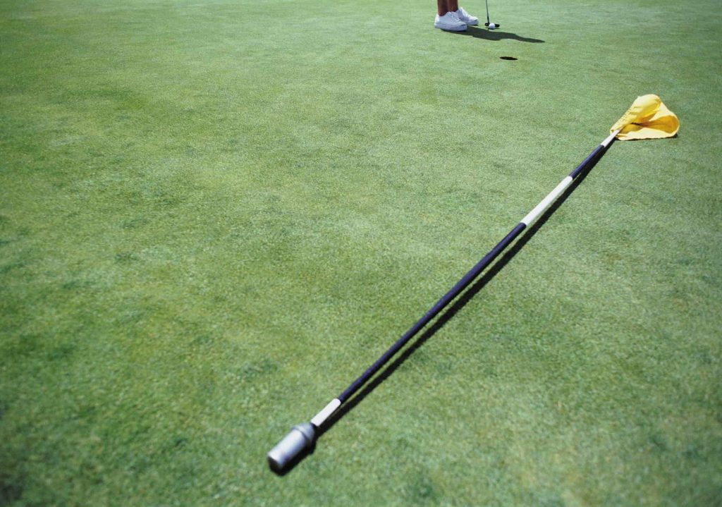 Can I shift a removed flagstick if my ball is going to hit it?