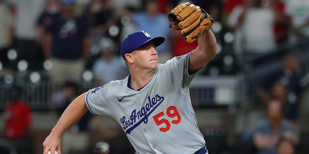 In camp for Tommy John rehab, Phillips happy to be back with Dodgers
