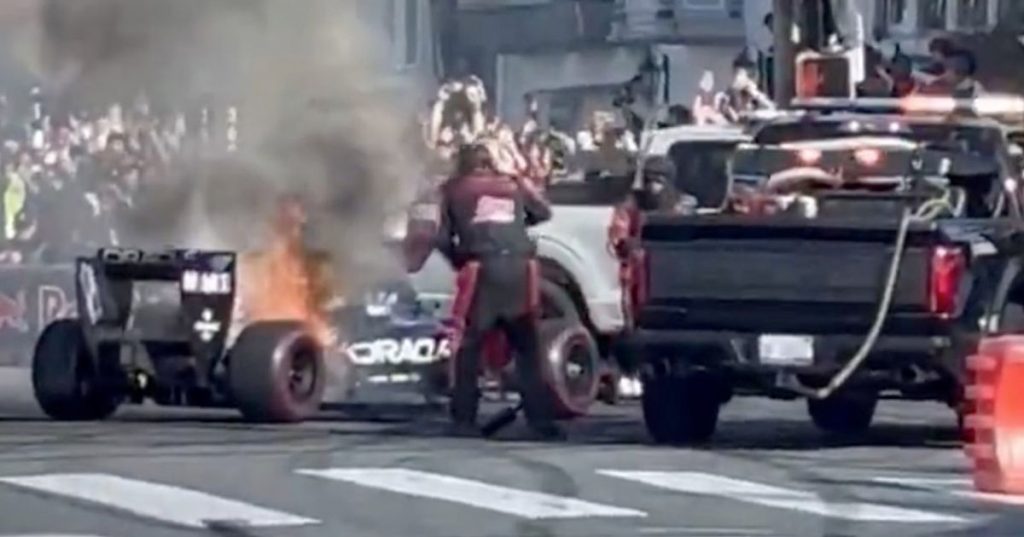 Red Bull car catches fire at F1 fan event as worried crowd warn driver