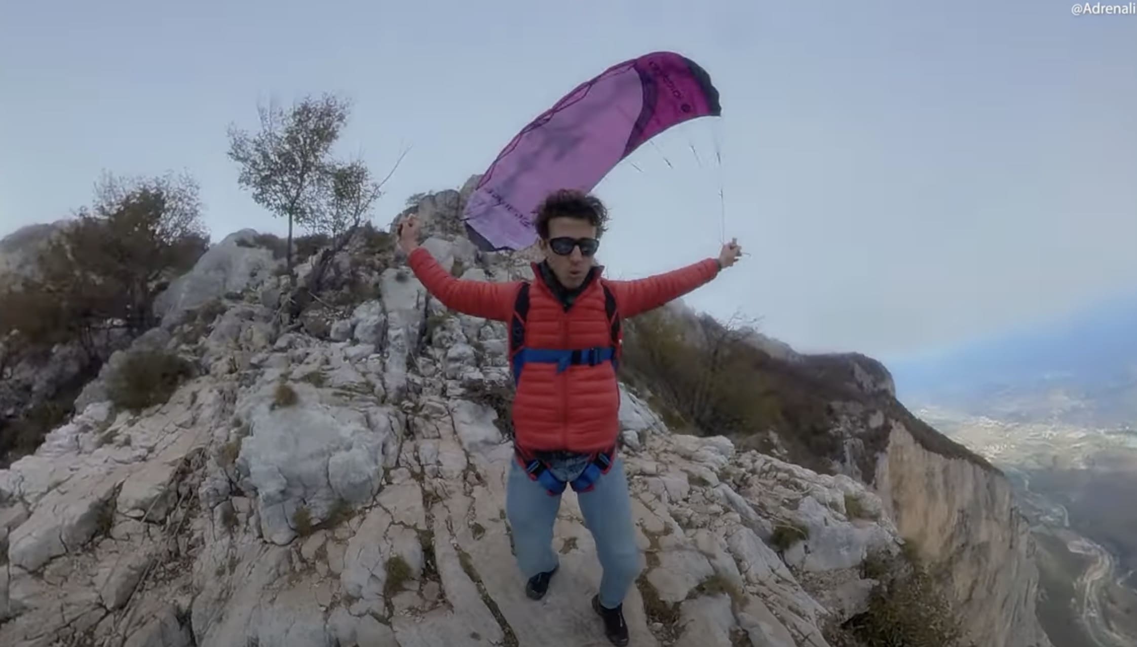 Watch: Guy Jumps Off Cliff With Comically Small Handheld Parachute