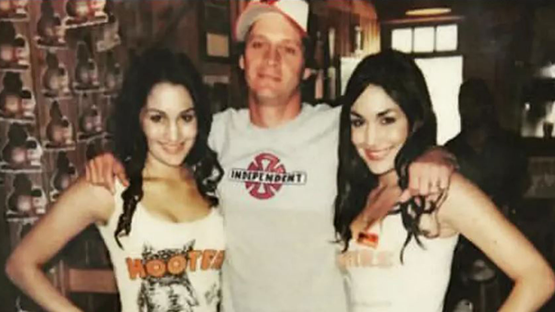 WWE legends Nikki and Brie Bella look almost unrecognizable as Hooters girls in tight-outfits before wrestling careers