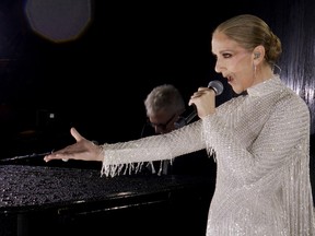 Céline Dion sings from Eiffel Tower at Olympics opening ceremony Céline Dion sings from Eiffel Tower at Olympics opening ceremony