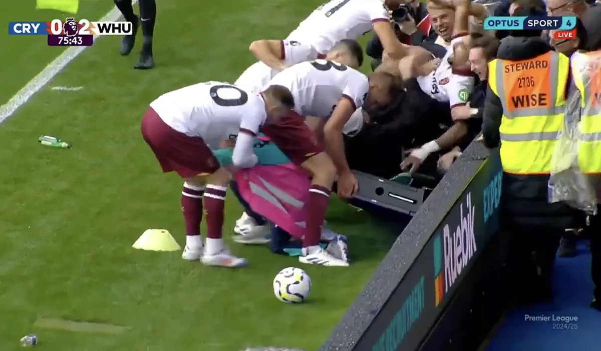 Quick-thinking West Ham players rescue ballboy from being crushed by fans