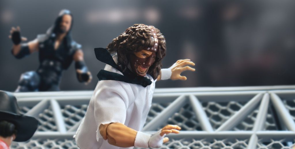 The Undertaker Tosses Mankind Off of the Hell In A Cell in Figure Photography The Undertaker Tosses Mankind Off of the Hell In A Cell in Figure Photography