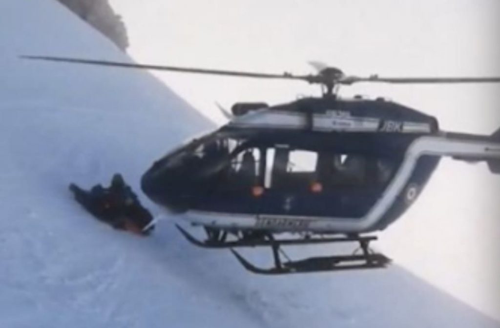 French Helicopter Pilot Performs Inch Perfect Rescue of Injured Skier On Steep Mountainside